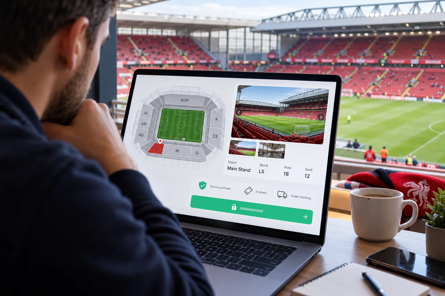A fan seated in a stadium suite overlooking the Anfield pitch, reviewing a laptop screen showing a seat selection interface. The screen displays a 2D stadium map highlighting Block L5 in the Main Stand alongside photos of the view, row/seat details, and checkout options.