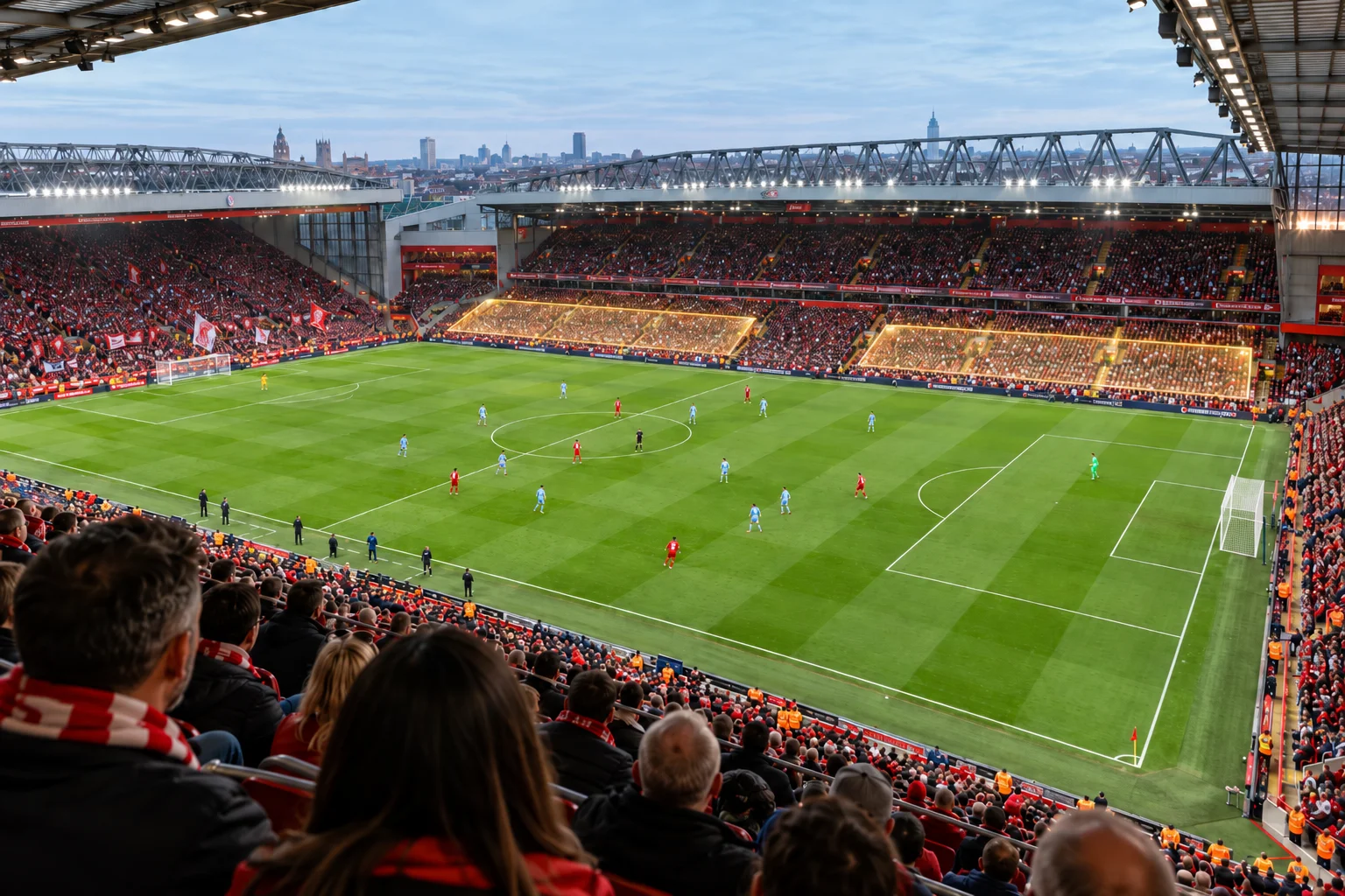 Elevated view of Anfield Stadium during a match, with two large lower-tier seating sections across the pitch highlighted in bright yellow boxes to indicate specific seat location zones.