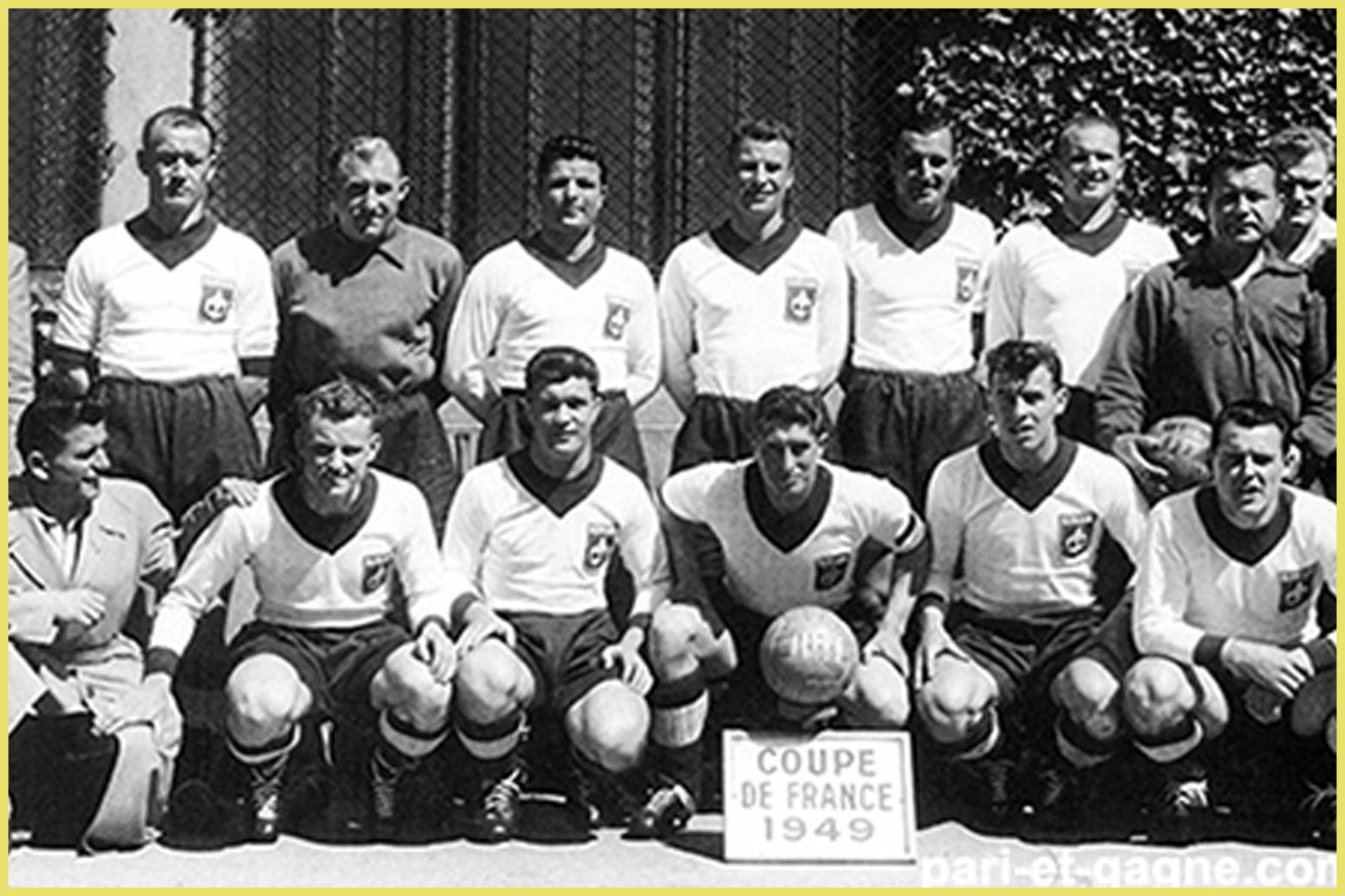 A historic black-and-white team photograph of the Lille football squad arranged in two rows. A small white sign positioned in front of the players reads "COUPE DE FRANCE 1949." The athletes are dressed in vintage white jerseys featuring prominent dark V-neck collars, paired with dark shorts.